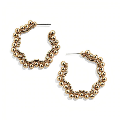 Gold hoop earrings close-up
